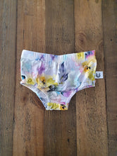 Load image into Gallery viewer, A romper in a stunning water colour style print with vibrant hints of lilac, yellow, orange and pink.