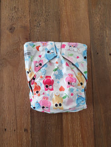 Beautiful soft pastel coloured owls on a silky white nappy, with charcoal grey inner.