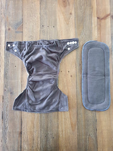 Image of charcoal grey inside of nappy and liner.