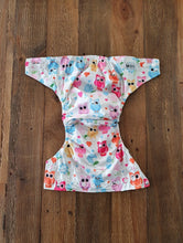 Load image into Gallery viewer, Beautiful soft pastel coloured owls on a silky white nappy, with charcoal grey inner.