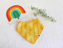Load image into Gallery viewer, Bib with bright yellow stripes, with white and orange suns. 