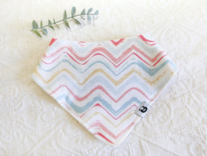 Beautiful waves of blues, yellows and pinks on a white background bib.