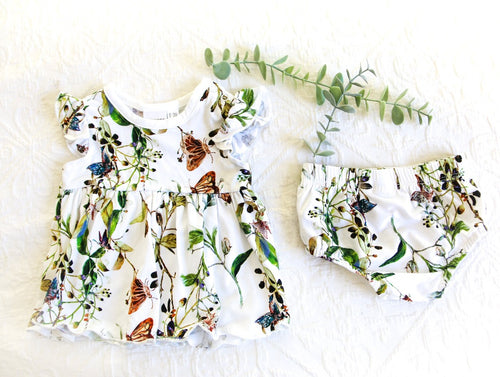 Beautiful butterflies with green vine print, on a white background romper: consisting of a dress and matching knickers. A timeless classic.