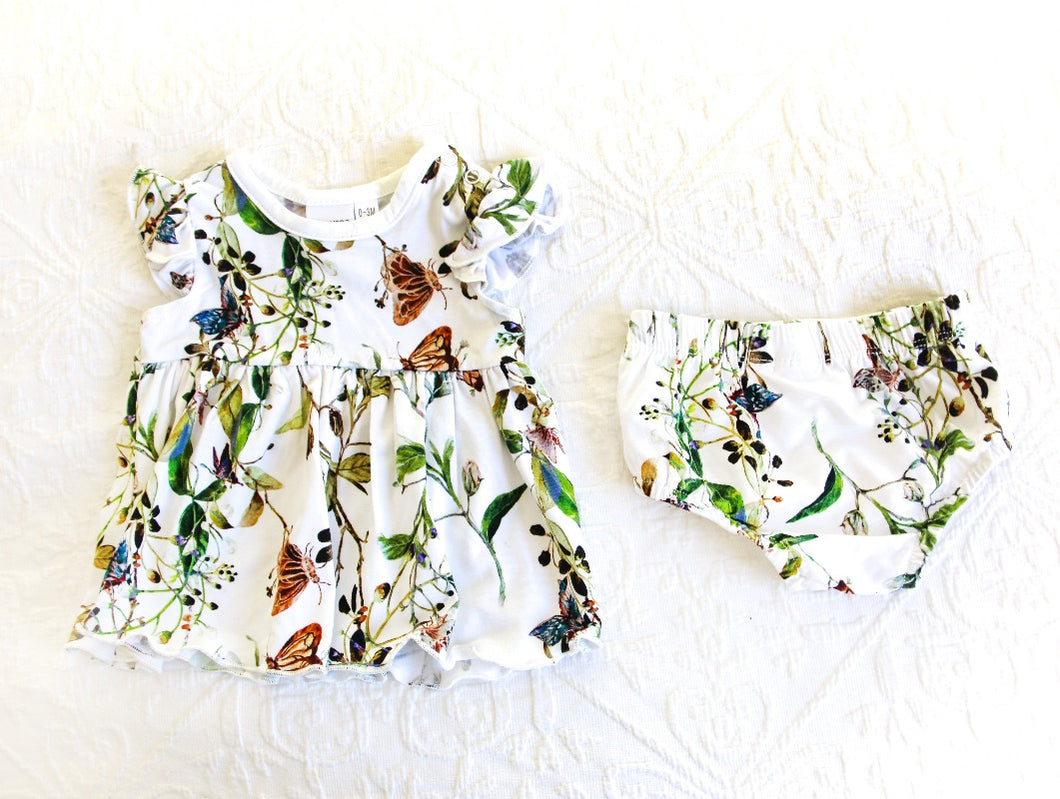 Beautiful butterflies with green vine print, on a white background romper: consisting of a dress and matching knickers. A timeless classic.