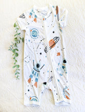 Load image into Gallery viewer, Cool onesie in neutral tones including blues, beige and black on a white background.