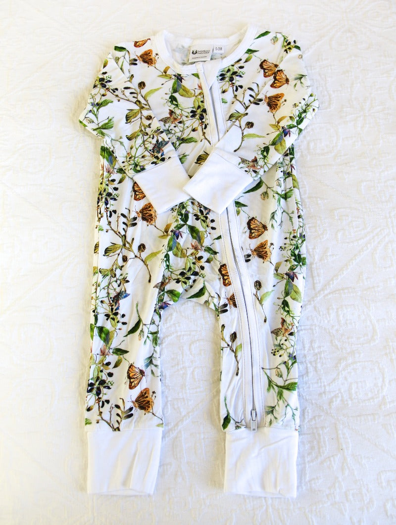 Beautiful butterflies with green vine print, on a white background onesie. A timeless classic.