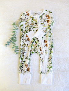 Beautiful butterflies with green vine print, on a white background onesie. A timeless classic.