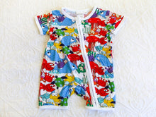 Load image into Gallery viewer, Vibrant and colourful short sleeve onesie with a host of fish and sea creatures, in a splash of attention grabbing colours including res, blue, yellow, green and purple.