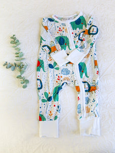 Cute and colourful safari animals, including a green elephant and orange lion, on a white long sleeve onesie.