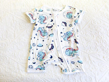 Load image into Gallery viewer, Baby blue T-rex&#39;s flying through space with stars and planets on a short white onesie.