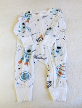 Load image into Gallery viewer, Astronaut in space, classic print on white background long sleeve onesie.