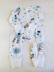 Astronaut in space, classic print on white background long sleeve onesie.