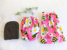 Load image into Gallery viewer, Bright hot pink nappy, with big bold bumblebees and daisy design