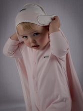Load image into Gallery viewer, Toddler wears blush pink onesie with towel resting on her head as a cape.