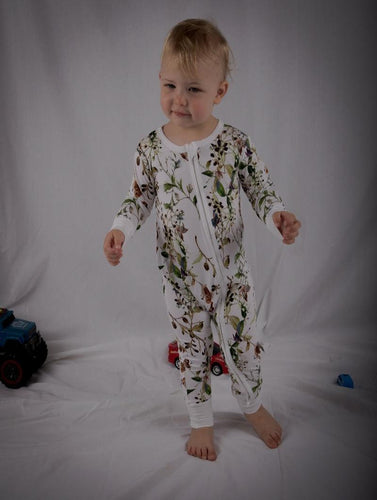 Baby stood in beautiful onesie